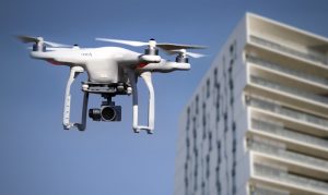 Security drone with camera and building